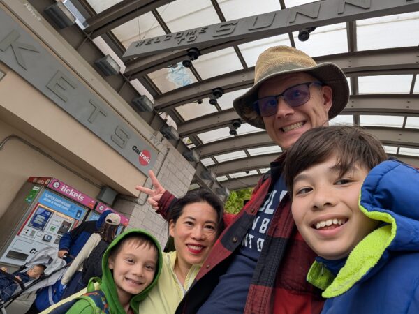 Danny's family pose for a group selfie at Sunnyvale Caltrain.